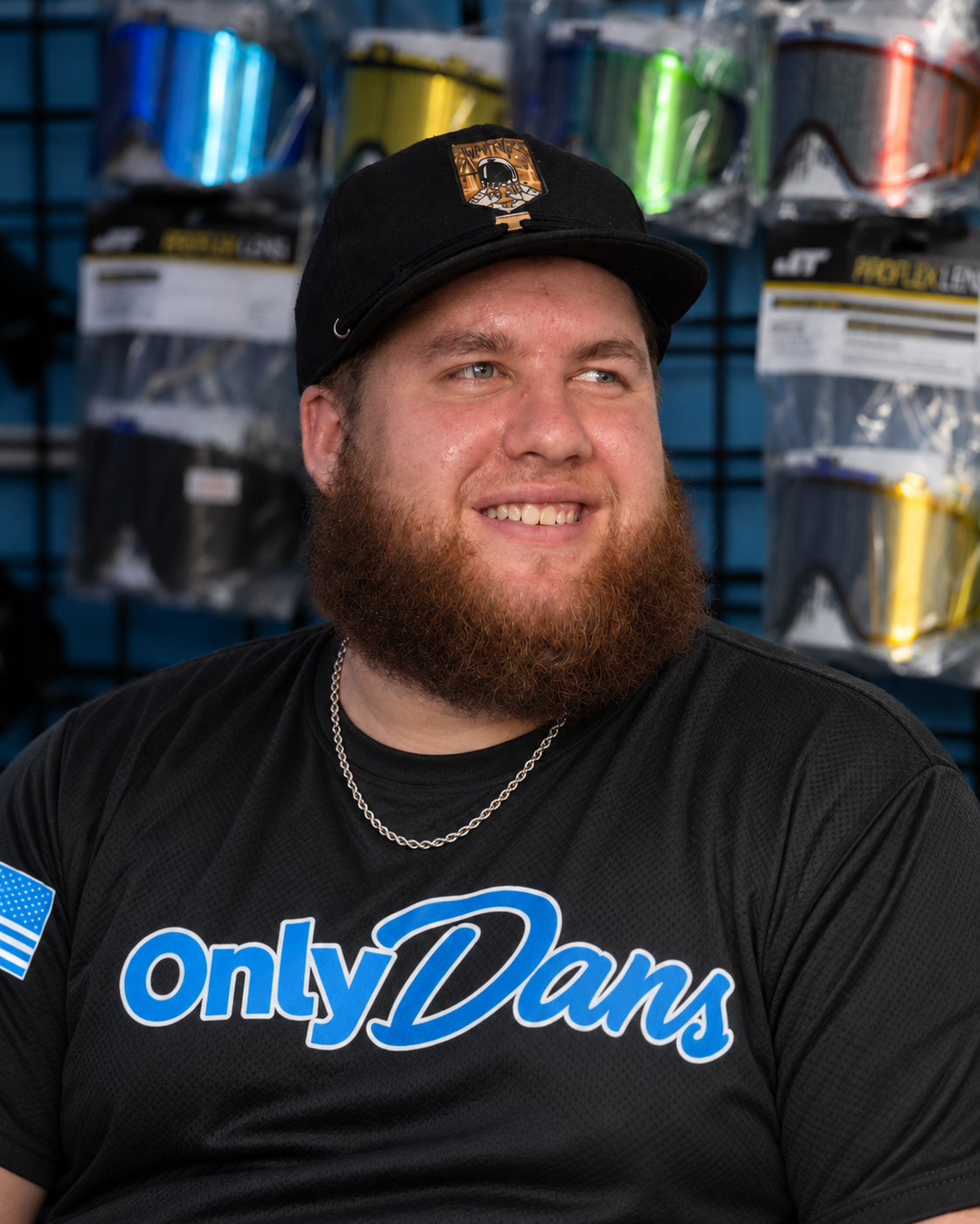 Dan Spence wearing a black OnlyDans shirt at the DirtyDanPB booth